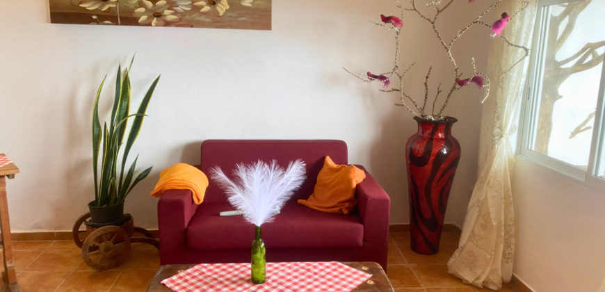 A house with a garden and a restaurant with panoramic views of the ocean and the city.