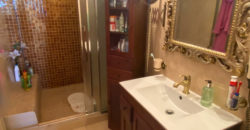 A house with a garden and a restaurant with panoramic views of the ocean and the city.