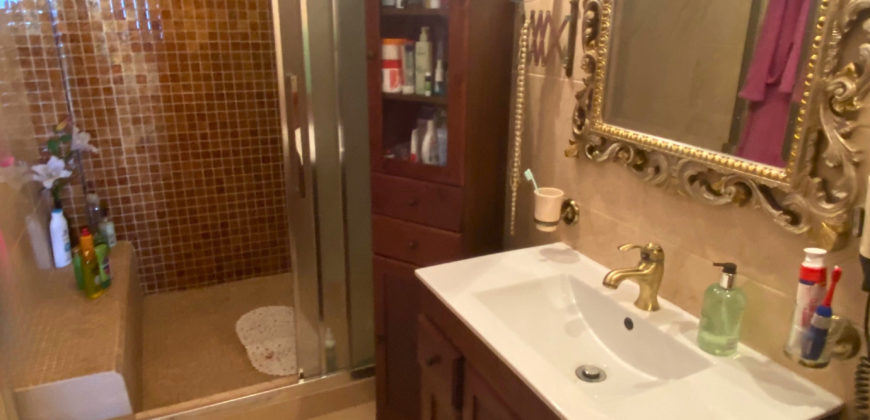 A house with a garden and a restaurant with panoramic views of the ocean and the city.