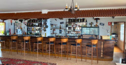 A house with a garden and a restaurant with panoramic views of the ocean and the city.