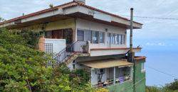 A house with a garden and a restaurant with panoramic views of the ocean and the city.