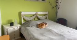 A house with a garden and a restaurant with panoramic views of the ocean and the city.