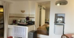 A house with a garden and a restaurant with panoramic views of the ocean and the city.