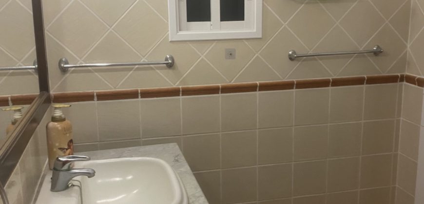 A house with a garden and a restaurant with panoramic views of the ocean and the city.