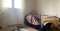 A house with a garden and a restaurant with panoramic views of the ocean and the city.